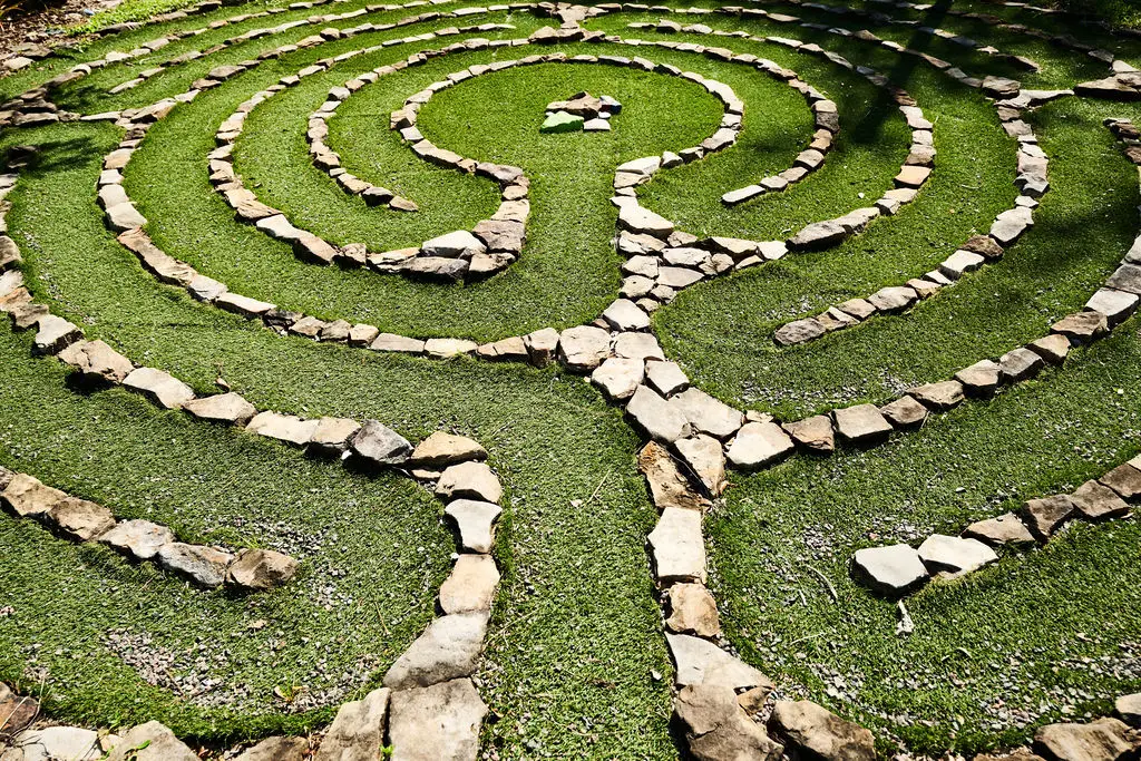 Stone meditation labyrinth on the lawn